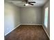Neutral bedroom with wood floors, natural light, and ample space for customizable furniture at 2005 Capri Rd, Valrico, FL 33594