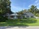 Charming single-story home with a well-maintained lawn and mature trees, offering great curb appeal at 2005 Capri Rd, Valrico, FL 33594