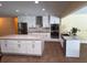 Modern kitchen featuring stainless steel appliances, granite countertops, and a large center island at 2005 Capri Rd, Valrico, FL 33594