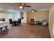 Expansive living area showcasing a dining table, custom cabinets, and multiple seating areas for entertaining at 2005 Capri Rd, Valrico, FL 33594