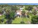 Overhead shot of a home highlighting a fenced backyard with a pool and tropical palm trees at 20352 Astoria Ave, Port Charlotte, FL 33952
