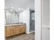 Bathroom featuring a double vanity, and a glass enclosed shower at 20352 Astoria Ave, Port Charlotte, FL 33952