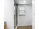 Bathroom with window, toilet and glass shower at 20352 Astoria Ave, Port Charlotte, FL 33952