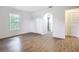 Bright bedroom features wood-look flooring, large window, and spacious closet at 20352 Astoria Ave, Port Charlotte, FL 33952