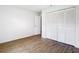 Bedroom with wood-look flooring and large closet at 20352 Astoria Ave, Port Charlotte, FL 33952