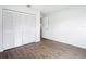 Bedroom with wood-look floors and closet at 20352 Astoria Ave, Port Charlotte, FL 33952