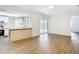 Open living space with sleek flooring, a modern kitchen, and sliding glass doors to a screened-in area at 20352 Astoria Ave, Port Charlotte, FL 33952