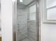 Modern glass-door shower features tile surround and a window at 20352 Astoria Ave, Port Charlotte, FL 33952