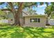 Mature shade tree in the well maintained and manicured backyard of the home at 205 W Wheeler Rd, Seffner, FL 33584