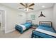 Bedroom furnished with matching twin beds, side tables and airplane decor at 205 W Wheeler Rd, Seffner, FL 33584