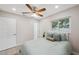Bright, tidy bedroom includes a window and closet with neutral colors throughout at 205 W Wheeler Rd, Seffner, FL 33584