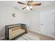 Bright Bedroom featuring a crib, area rug, moon decor, and natural lighting at 205 W Wheeler Rd, Seffner, FL 33584