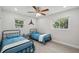Bedroom furnished with matching twin beds, side tables and decor at 205 W Wheeler Rd, Seffner, FL 33584