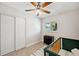 Charming bedroom featuring a crib, closet, and vinyl flooring at 205 W Wheeler Rd, Seffner, FL 33584