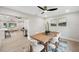 Dining room with modern table and chairs that leads into a spacious living area at 205 W Wheeler Rd, Seffner, FL 33584
