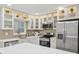 Bright kitchen with stainless steel appliances, designer backsplash, and quartz countertops at 205 W Wheeler Rd, Seffner, FL 33584