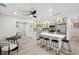 Modern kitchen features a center island, stainless steel appliances and glass front cabinets at 205 W Wheeler Rd, Seffner, FL 33584