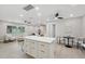 Bright kitchen with island that has barstool seating is connected to the living space at 205 W Wheeler Rd, Seffner, FL 33584