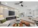 Open concept living room with fireplace and view of the kitchen and dining area at 205 W Wheeler Rd, Seffner, FL 33584
