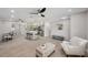 Open-concept living space with a modern kitchen and island, perfect for entertaining at 205 W Wheeler Rd, Seffner, FL 33584
