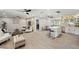 Spacious living room flowing into kitchen with an island and modern finishes at 205 W Wheeler Rd, Seffner, FL 33584