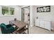Inviting home office featuring a desk, cabinet, and natural light at 205 W Wheeler Rd, Seffner, FL 33584