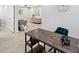 Bright office area featuring a desk, cabinet, and living room at 205 W Wheeler Rd, Seffner, FL 33584