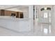 Welcoming foyer area featuring a clear view of the kitchen and a stylish front door at 211 Arlington E Ave, Oldsmar, FL 34677