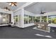 This large indoor recreation room features comfortable seating, many windows, and a billiards table at 211 Arlington E Ave, Oldsmar, FL 34677