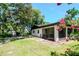 Expansive backyard with a screened-in porch, offering privacy and relaxation at 23924 Forest Pl, Land O Lakes, FL 34639