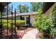 The home has a quaint brick walkway leading to the wrought iron gated courtyard at 23924 Forest Pl, Land O Lakes, FL 34639
