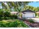 Well kept home with a two-car garage, beautiful landscaping, and a wrought iron gated courtyard at 23924 Forest Pl, Land O Lakes, FL 34639