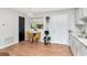 Bright kitchen features white cabinets, granite countertops, and breakfast nook at 23924 Forest Pl, Land O Lakes, FL 34639
