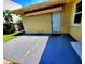 Backyard patio view featuring a door with an awning and neutral paint at 2645 Woodring Dr, Clearwater, FL 33759