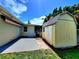 Backyard view featuring a shed and screened-in patio at 2645 Woodring Dr, Clearwater, FL 33759