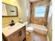 This bathroom features a shower-tub combination and an updated vanity at 2645 Woodring Dr, Clearwater, FL 33759