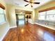 This is an open-concept living room with wood floors, and an opening to the kitchen at 2645 Woodring Dr, Clearwater, FL 33759