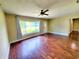 Well-lit living room with hardwood floors, a ceiling fan, and view to the front yard at 2645 Woodring Dr, Clearwater, FL 33759