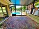 Screened in patio with brick pavers offers views of the pool at 2645 Woodring Dr, Clearwater, FL 33759