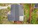 A top-down aerial view highlights the home's roof and screened in porch at 2837 Woodcrest Dr, Sarasota, FL 34239