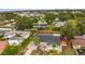 An aerial view showcases the property's roof, driveway, lawn and proximity to nearby amenities at 2837 Woodcrest Dr, Sarasota, FL 34239