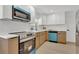 Well-appointed kitchen showcasing stainless steel appliances and stylish cabinetry at 2837 Woodcrest Dr, Sarasota, FL 34239