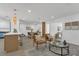 Open-concept living space with bar seating, dining area, and comfortable seating at 2837 Woodcrest Dr, Sarasota, FL 34239