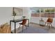 Bright home office with large windows, a desk, seating, and natural light, perfect for working or studying at 2837 Woodcrest Dr, Sarasota, FL 34239