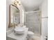 Beautiful bathroom features a glass enclosed marble shower, new vanity, and bright lighting at 2905 Forest Cir, Seffner, FL 33584