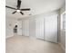 This bedroom features a ceiling fan, two closets and neutral paint and tile floors at 2905 Forest Cir, Seffner, FL 33584