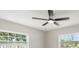 Bedroom featuring a modern ceiling fan, neutral colors, and large windows for natural light at 2905 Forest Cir, Seffner, FL 33584