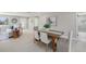Cozy dining area featuring a wooden table with upholstered chairs, tile floors, and natural light from nearby rooms at 2905 Forest Cir, Seffner, FL 33584