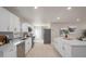 Bright, updated kitchen featuring white cabinets, stainless steel appliances and spacious countertops at 2905 Forest Cir, Seffner, FL 33584