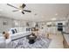 Open concept living room with an area that includes modern decor, and a seamless transition to the kitchen and dining area at 2905 Forest Cir, Seffner, FL 33584